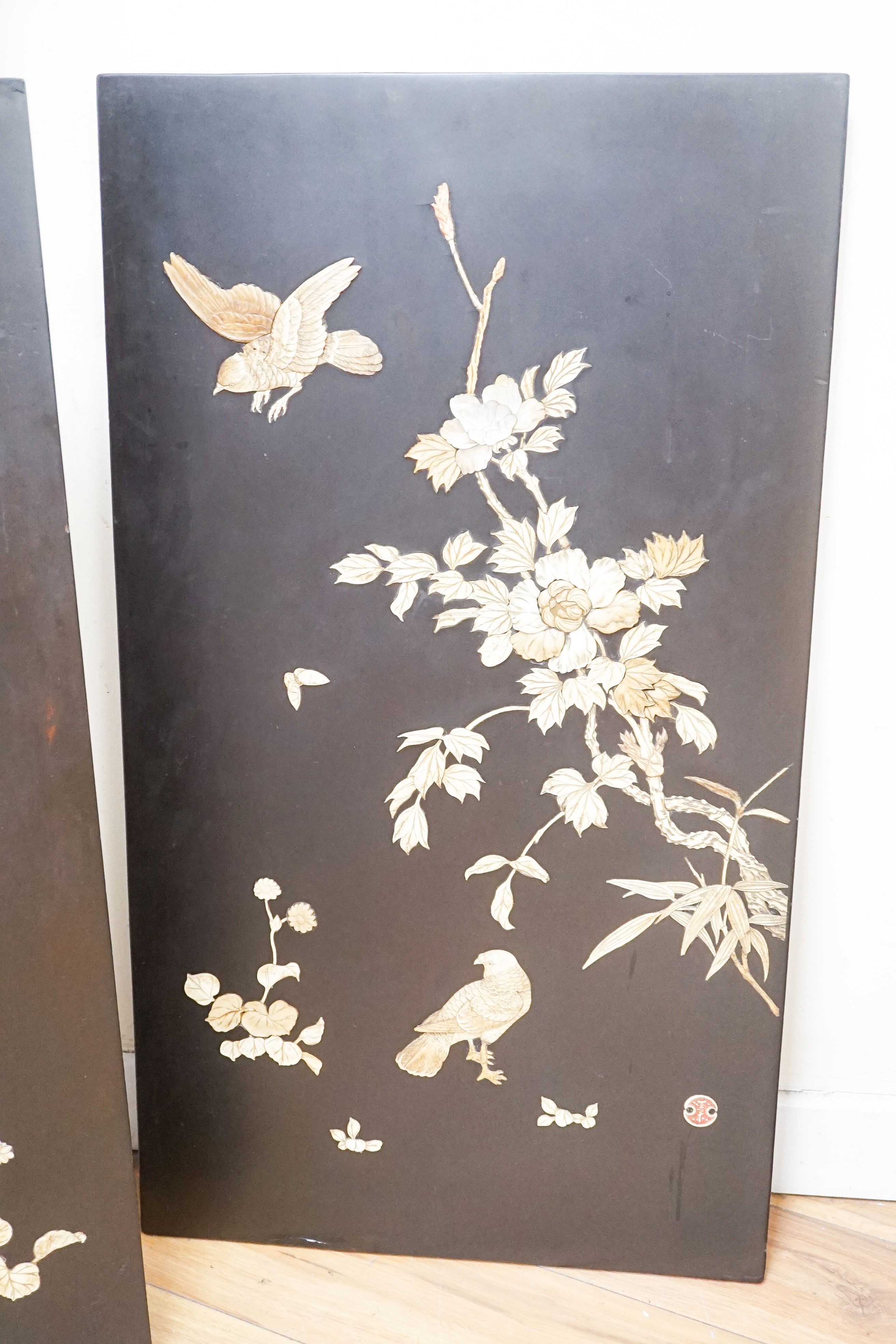 A pair of late 19th century Japanese bone and mother of pearl inlaid shibayama style panels of birds amid flowers, 91 x 51cm